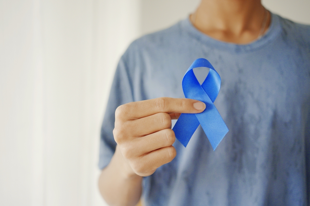 Hands,Holding,Blue,Ribbon,,Prostate,Cancer,Awareness,,November,Blue,,Men